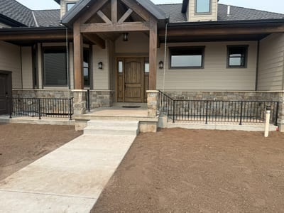 Grey-black ornamental steel railing — view 2.