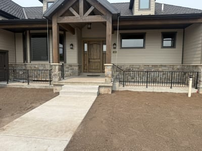 Grey-black ornamental steel railing — view 2.