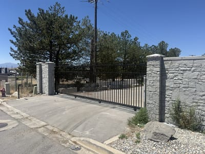 Black steel automated sliding driveway gate — view 4.